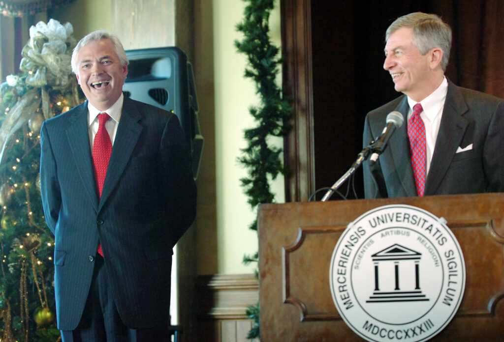 Bill Underwood, left, laughs as David Hudson describes how the seach for a new Mercer University president virtually ended last October after trustees met with Underwood.