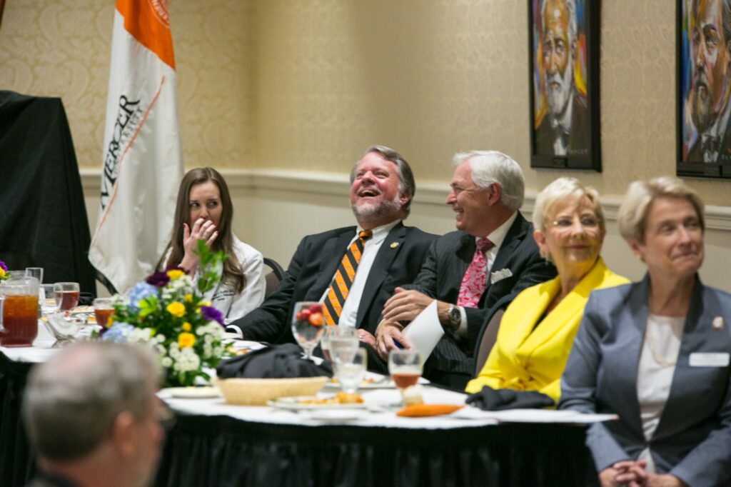 President Underwood sitting at a table with others