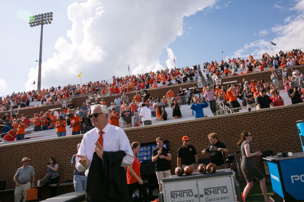 President Underwood standing on the sidelines at a football game