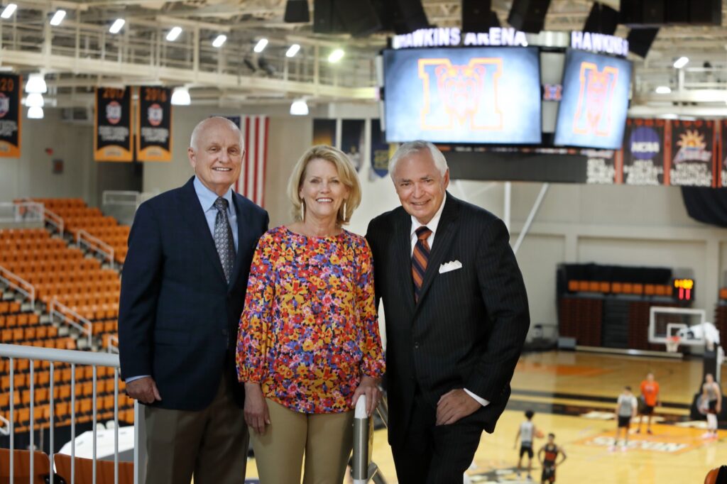 President Underwood standing with Dr. and Mrs. Hawkins