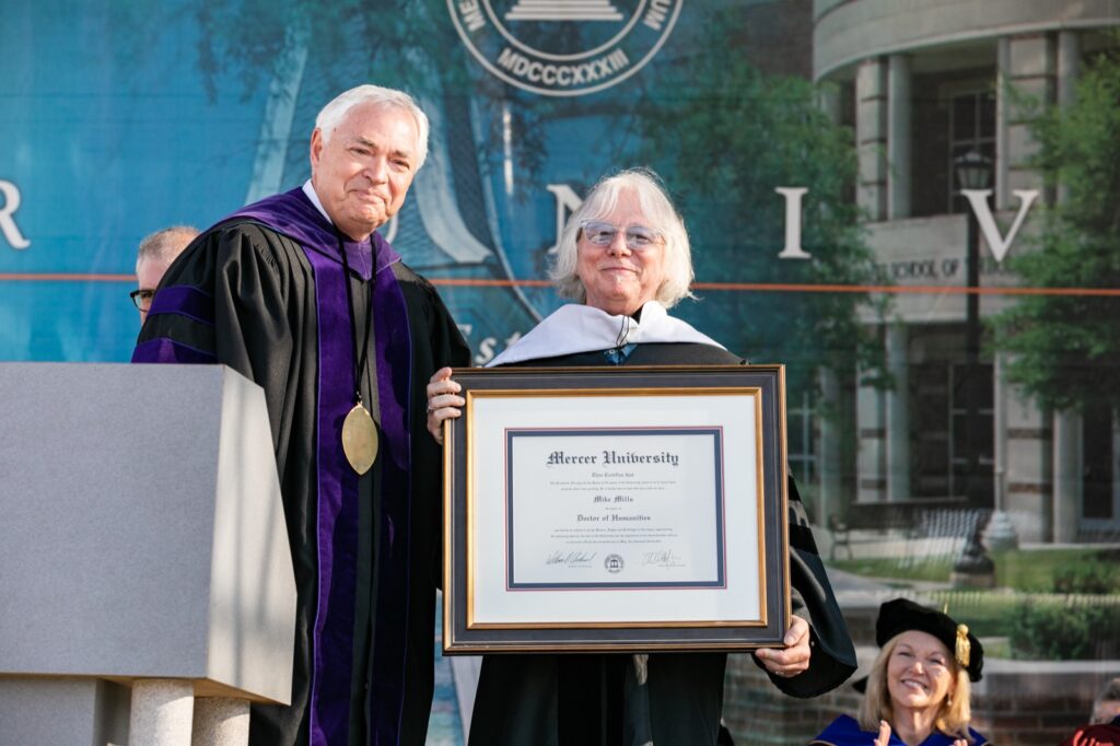 President Underwood standing with Mike Mills at Commencement