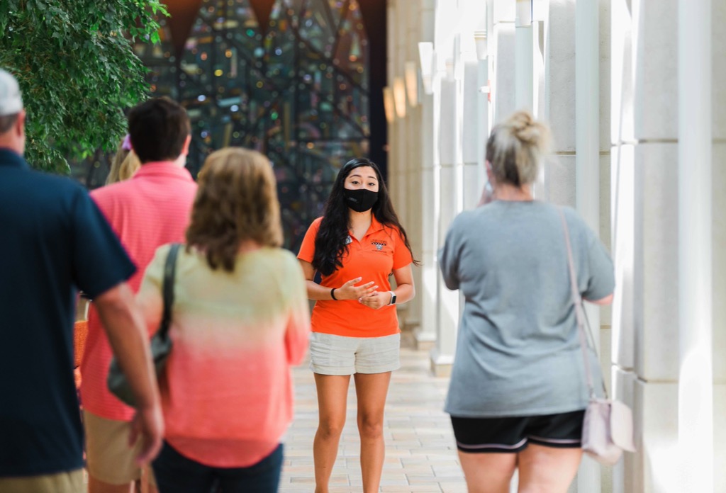 Female gives a tour to visitors