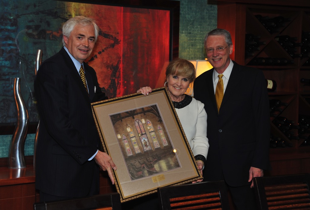 President Underwood presenting a framed photo to Daniel Vestal and Babs Baugh