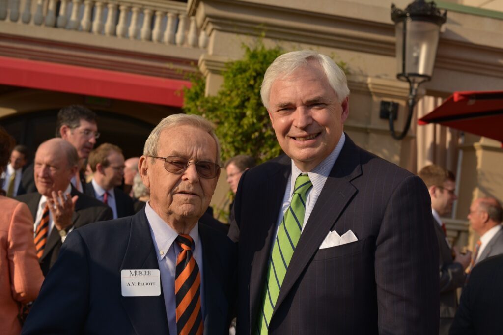 President Underwood standing with A.V. Elliott