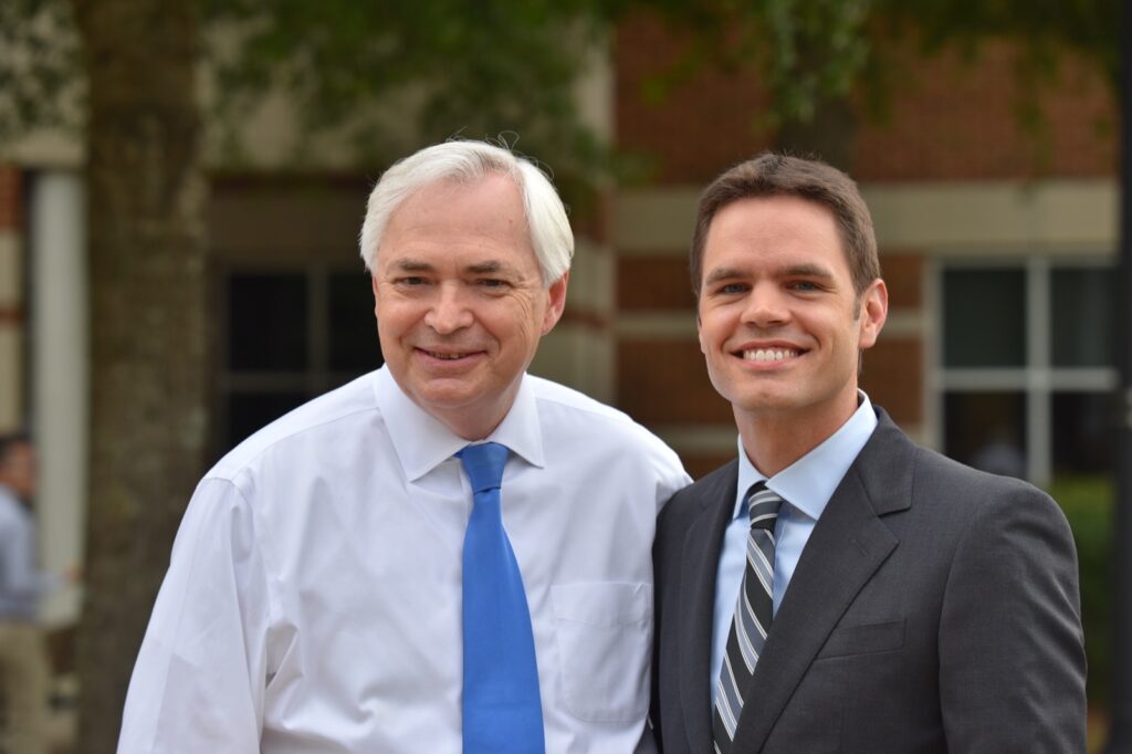 President Underwood standing with an unknown male