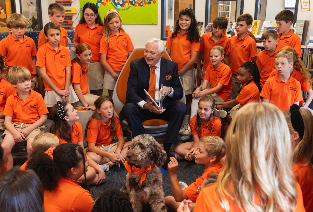 President Underwood with students at Roberts Academy